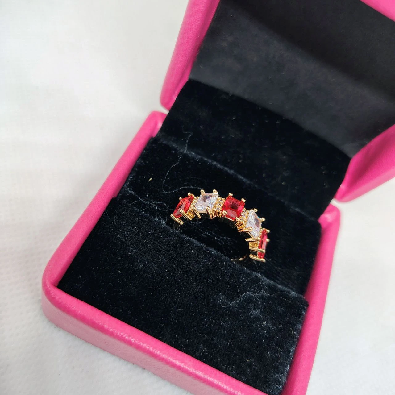 vibrant gold ring adorned with colorful gemstones,