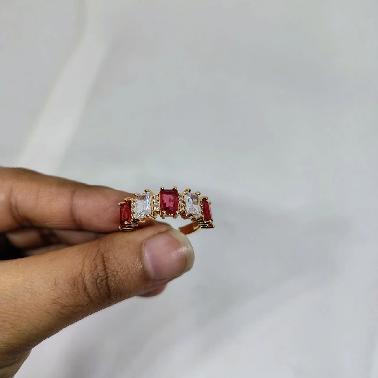 vibrant gold ring adorned with colorful gemstones,