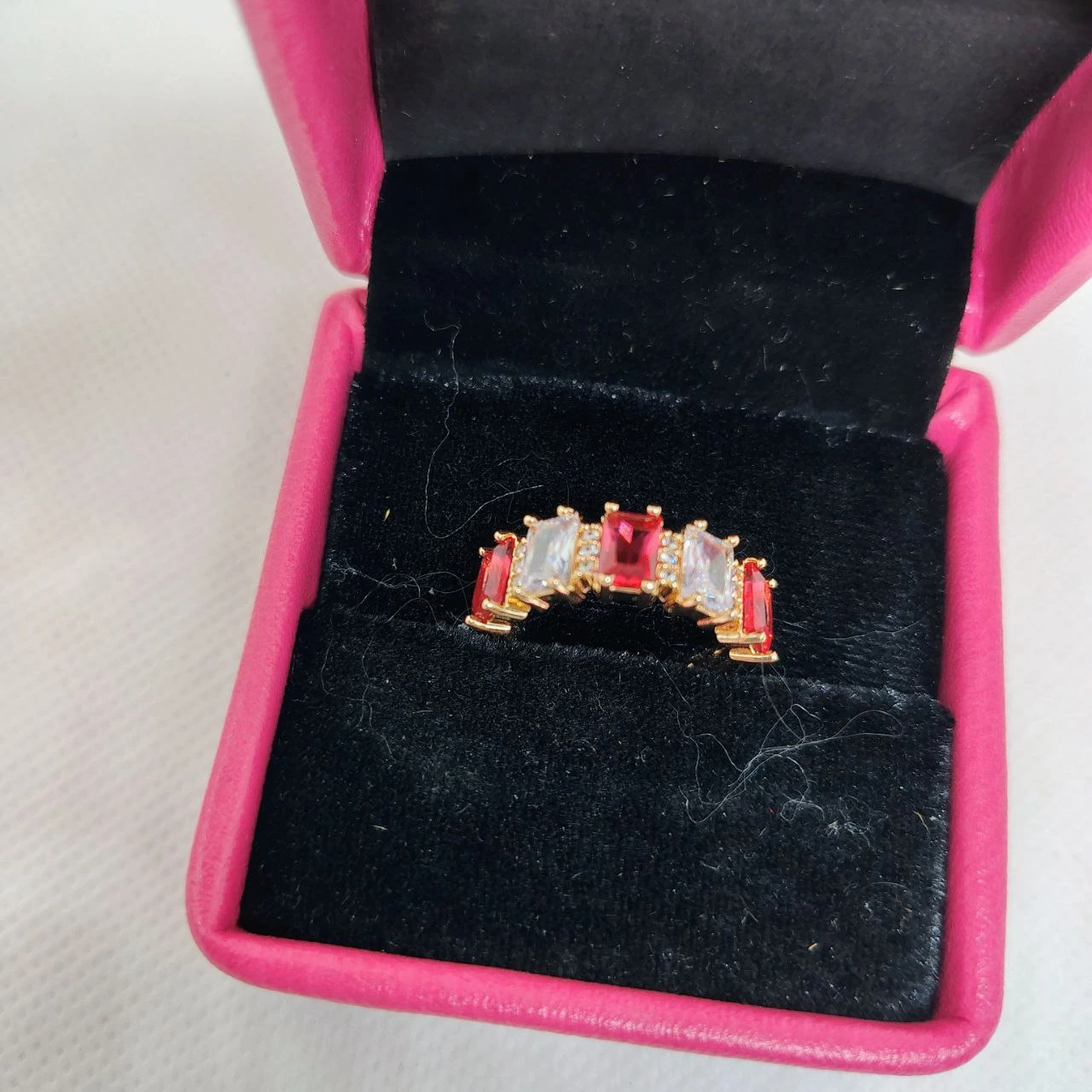 vibrant gold ring adorned with colorful gemstones,
