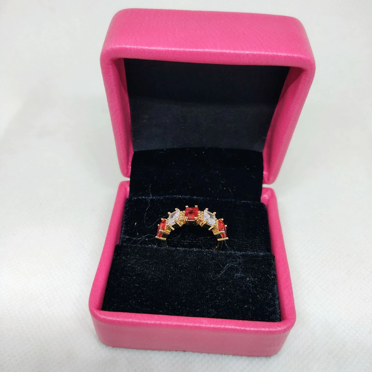 vibrant gold ring adorned with colorful gemstones,